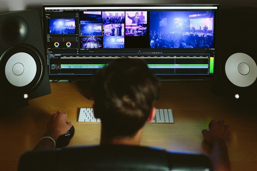 Broadcast control room with multiple video monitors and switching desk